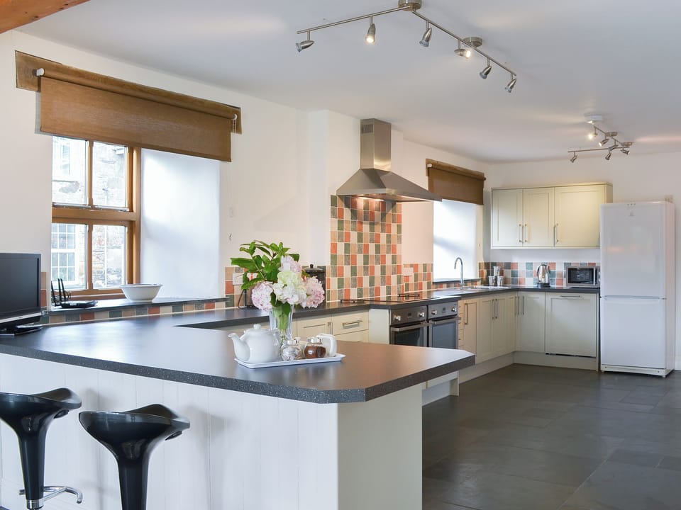 Large fitted kitchen with breakfast bar | Polmear Barn, Tregoodwell, Camelford
