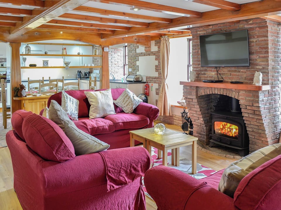 Comfortable open plan living space | Bridge House - Lower North Radworthy Cottages, Heasley Mill, near South Molton