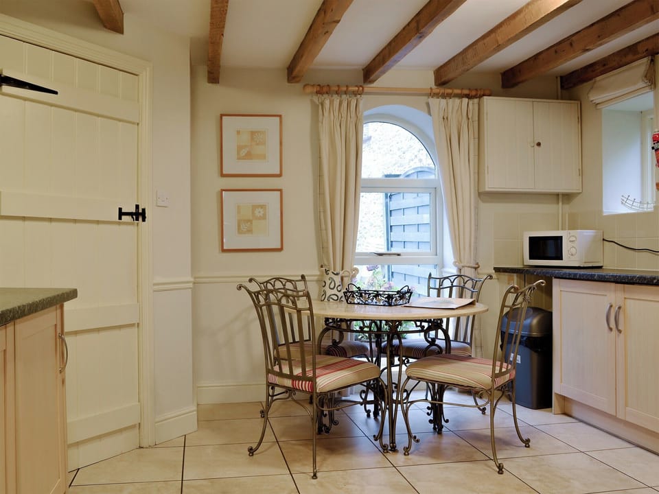 Kitchen/ diner with beamed ceiling | The Granary - Crwys Farm, Three Crosses, Gower, Swansea