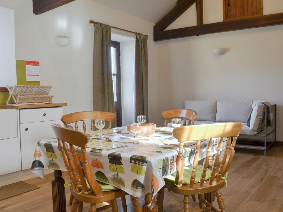 Stylish kitchen and dining area | Ysgubor - Chwarel Goch Cottages, Tregarth, near Bangor