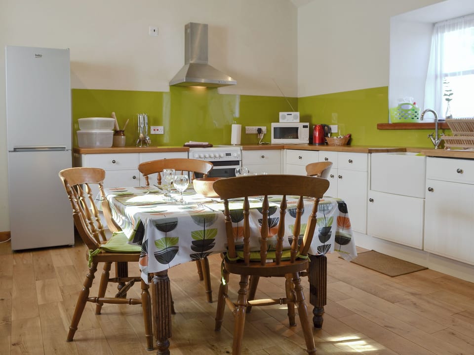 Spacious kitchen and dining area | Ysgubor - Chwarel Goch Cottages, Tregarth, near Bangor
