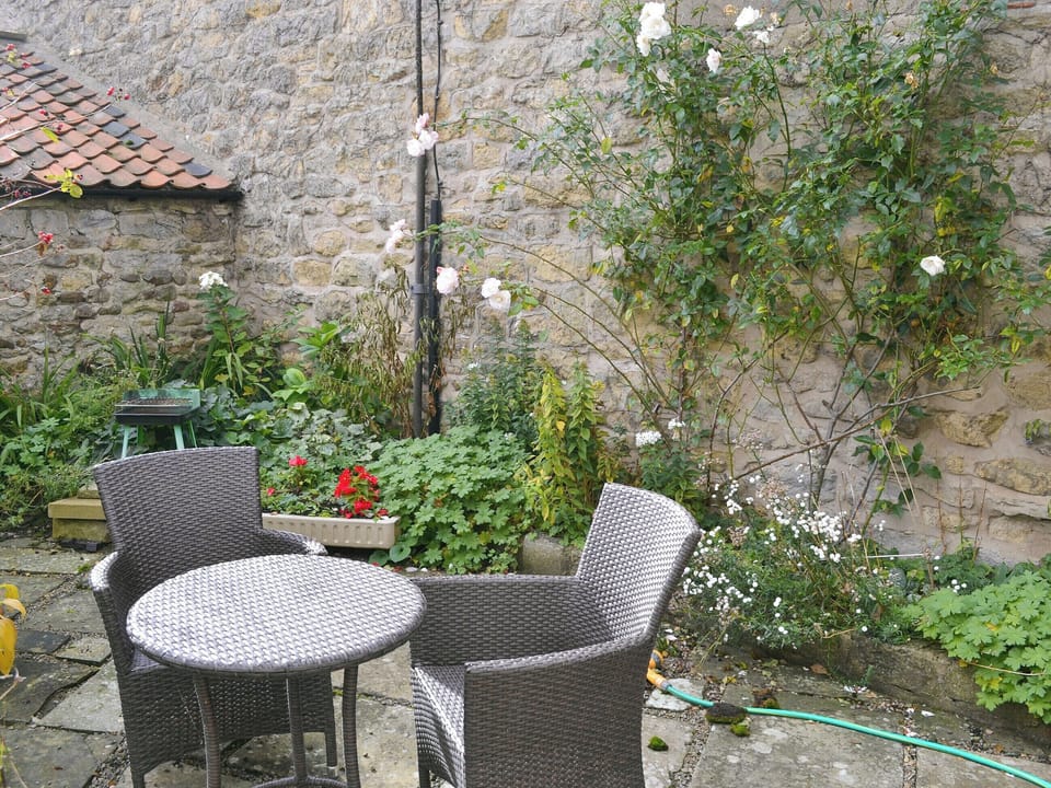 Garden furniture on paved patio area | The Cottage - The Cottage & Lilac Cottage, Sinnington, near Pickering