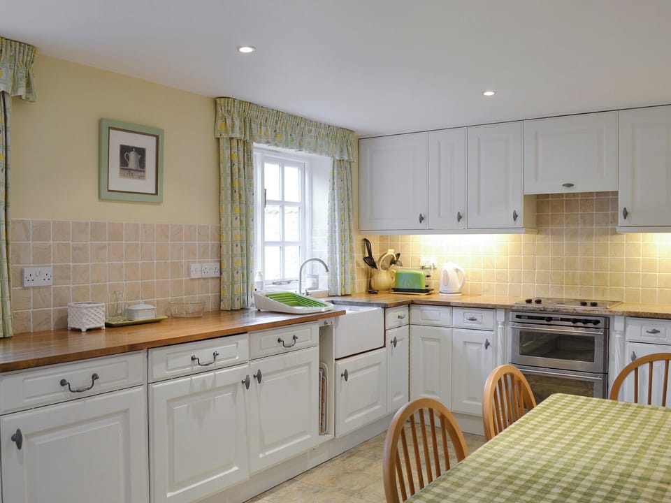 Well-equipped fitted kitchen with dining area | The Cottage - The Cottage & Lilac Cottage, Sinnington, near Pickering