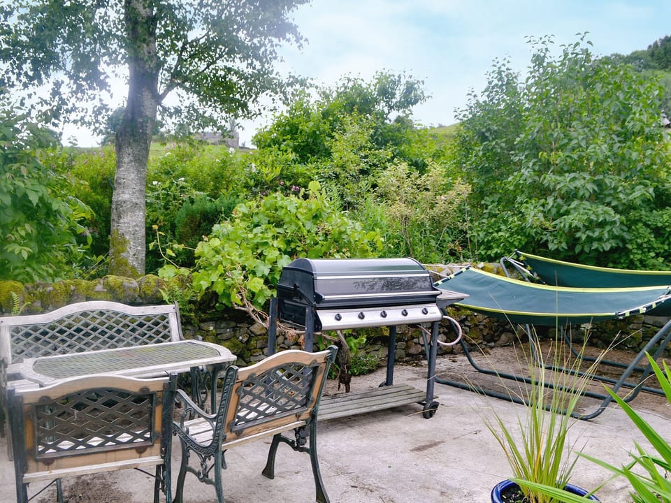 Sitting-out area, garden furniture and BBQ | The Cottage, Glenmidge, Auldgirth, near Dumfries