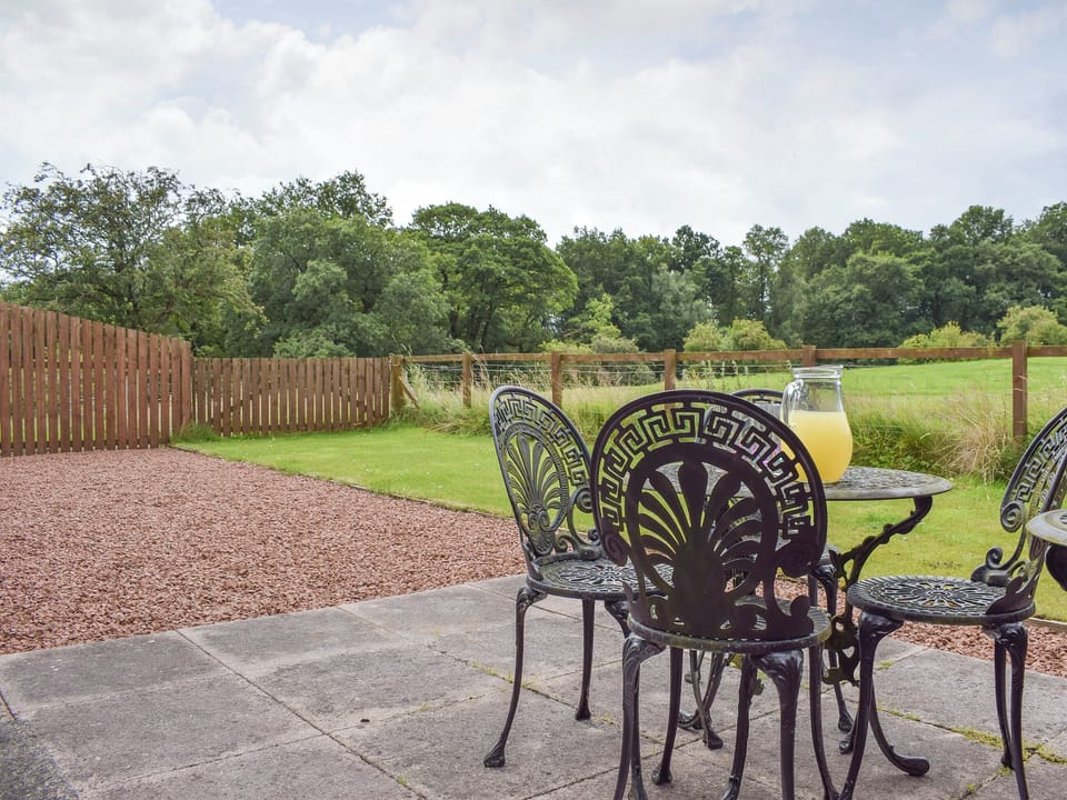 Lovely countryside views from the patio | The Stables - Loch Lomond Farm Cottages, Balfron Station, near Stirling