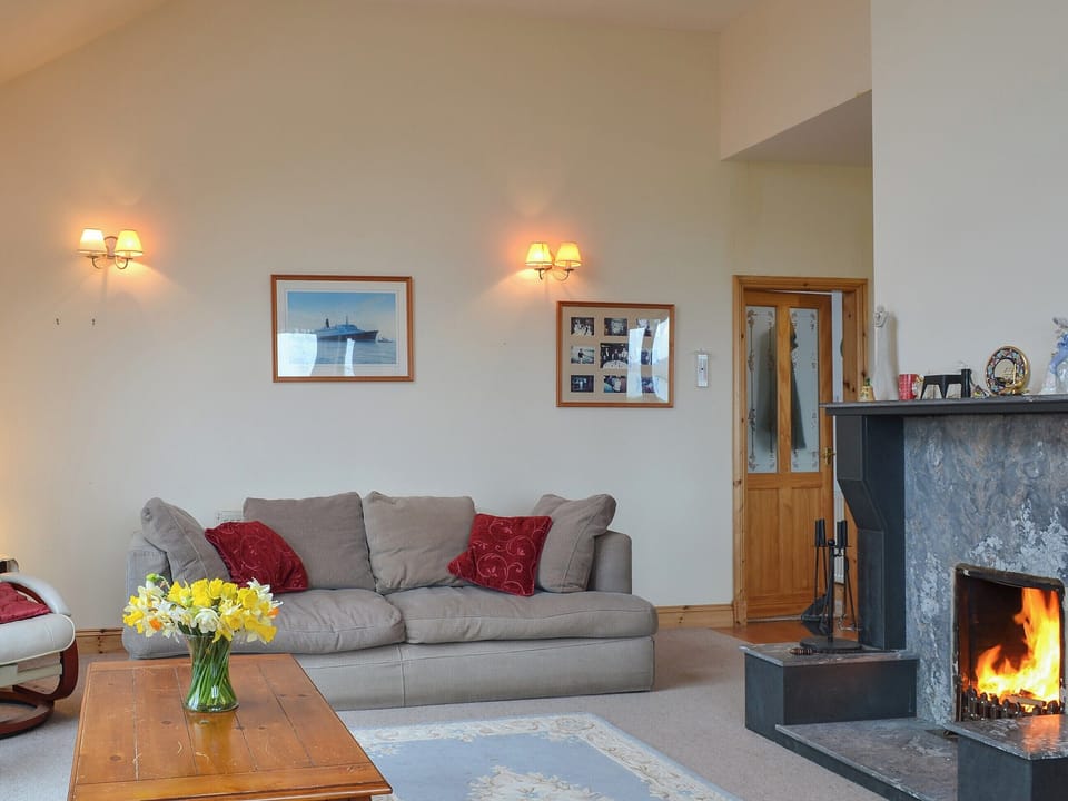 Welcoming living/dining room with open fireplace | Sealladh Lingeigh, East Kilbride, near Lochboisdale, South Uist