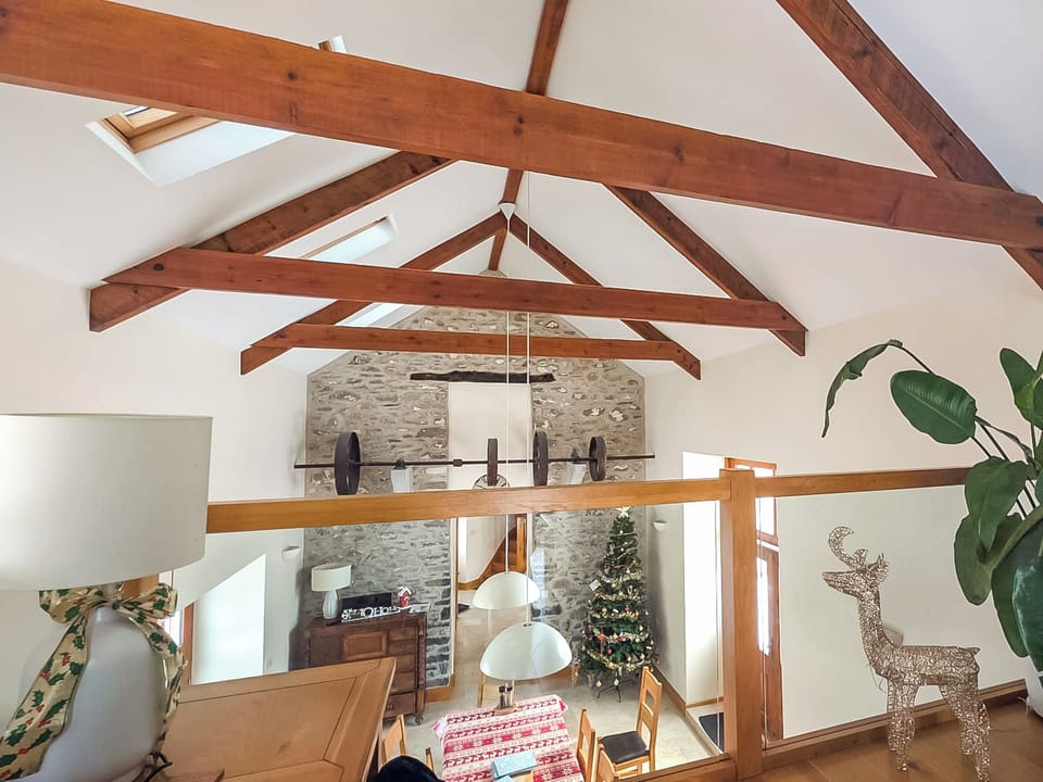 View from the mezzanine, overlooking the dining table | Felin Hedd - Red Kite Holidays, Tregaron, near Aberystwyth