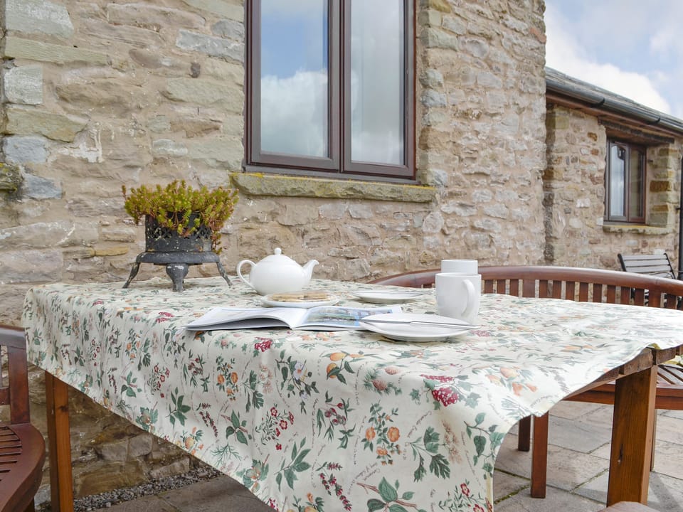 Paved patio with outdoor furniture | White Hill Farm Cottage, Wonastow, near Monmouth