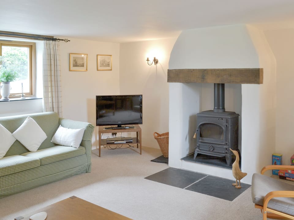 Welcoming living room with wood burner | The Shippon, St Gennys, Bude