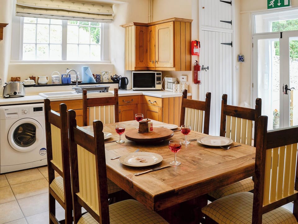 Delightful kitchen/diner with double doors to the decked area | Crogen Wing, Bala