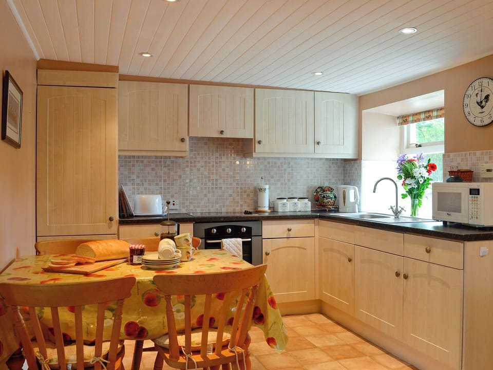 Well-equipped kitchen and dining area | Gullieside Cottage, Kirkandrews, near Kirkcudbright