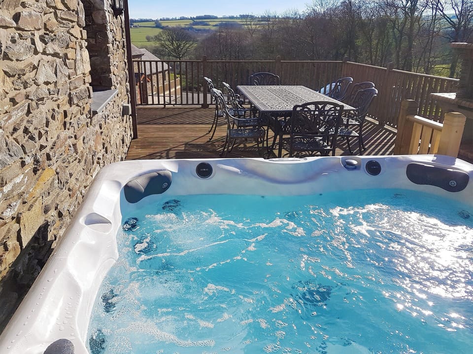 Relaxing hot tub | The Mill - Ffynnonmeredydd Cottages, Mydroilyn, near Aberaeron
