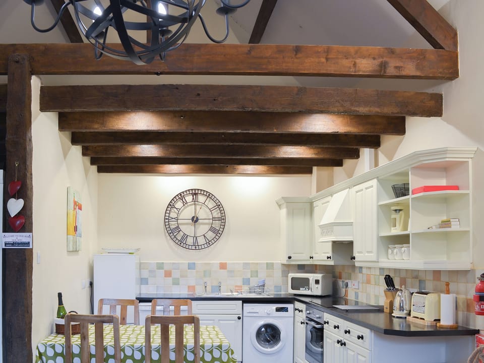 Kitchen/dining room with exposed beams | Rook - Newhouse Barton, Ipplepen, near Totnes
