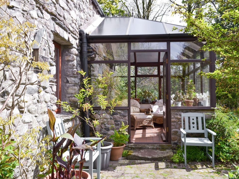 Paved patio with outdoor furniture | The Coach House, Bootle, near Millom