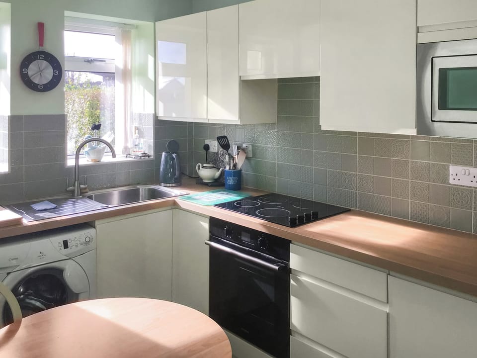 Farmhouse style kitchen with informal dining area | Hazeldene - Murton Farm, Murton, near Swansea