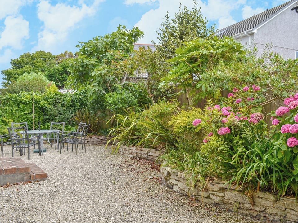 Patio garden with sitting out area | Poppy Cottage, Crantock, near Newquay