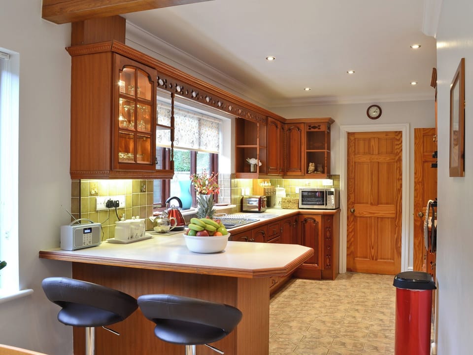 Kitchen with breakfast bar | Dyffryn Haidd - Afan Holiday Cottages, llanafan/Aberystwyth