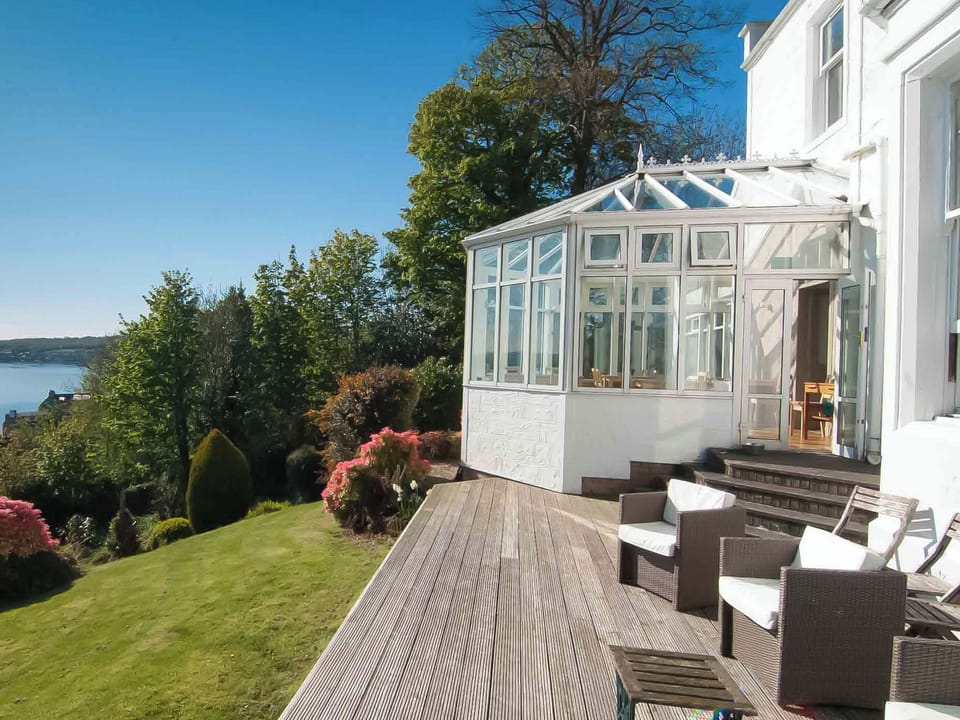 Relax on the sunny decked area and take in the wonderful view | Munro&rsquo;s, Rothesay, Isle of Bute