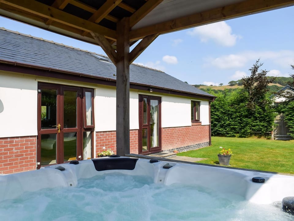 Hot tub | River Cottage - Mill Farm Holiday Cottages, Heyope, near Knighton