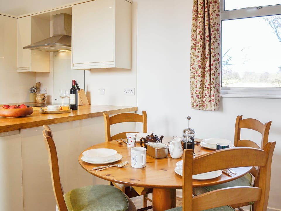 Modest dining area adjacent to the kitchen | The Coach House, Alford