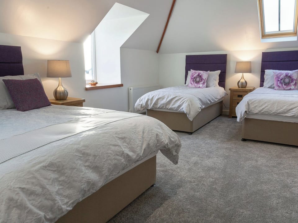 Family bedroom with a double and twin beds | Sunset View, Port Lamont, near Dunoon