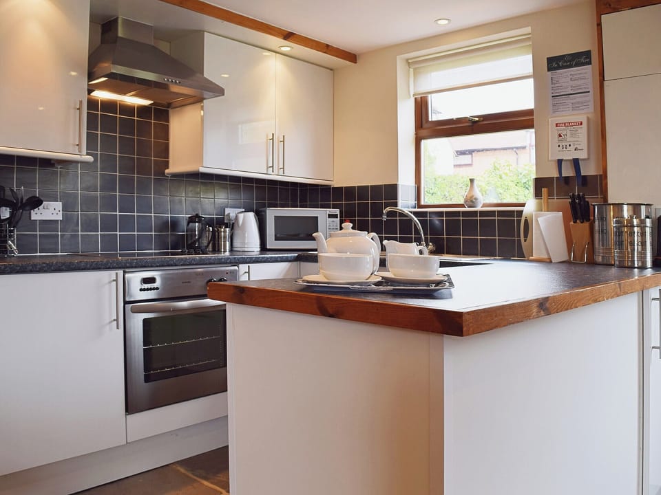 The kitchen area is flag-floored and finished to a high standard | The Byre, Bidford-on-Avon, near Alcester
