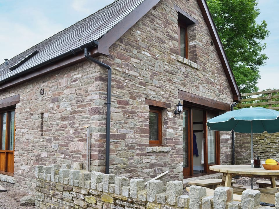 Courtyard with garden furniture | LlaethdyMilkhouse, Talgarth, near Brecon