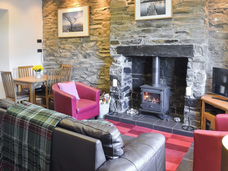 Cosy living room with wood burner | Gwyrfai Cottage, Waunfawr, near Caernarfon