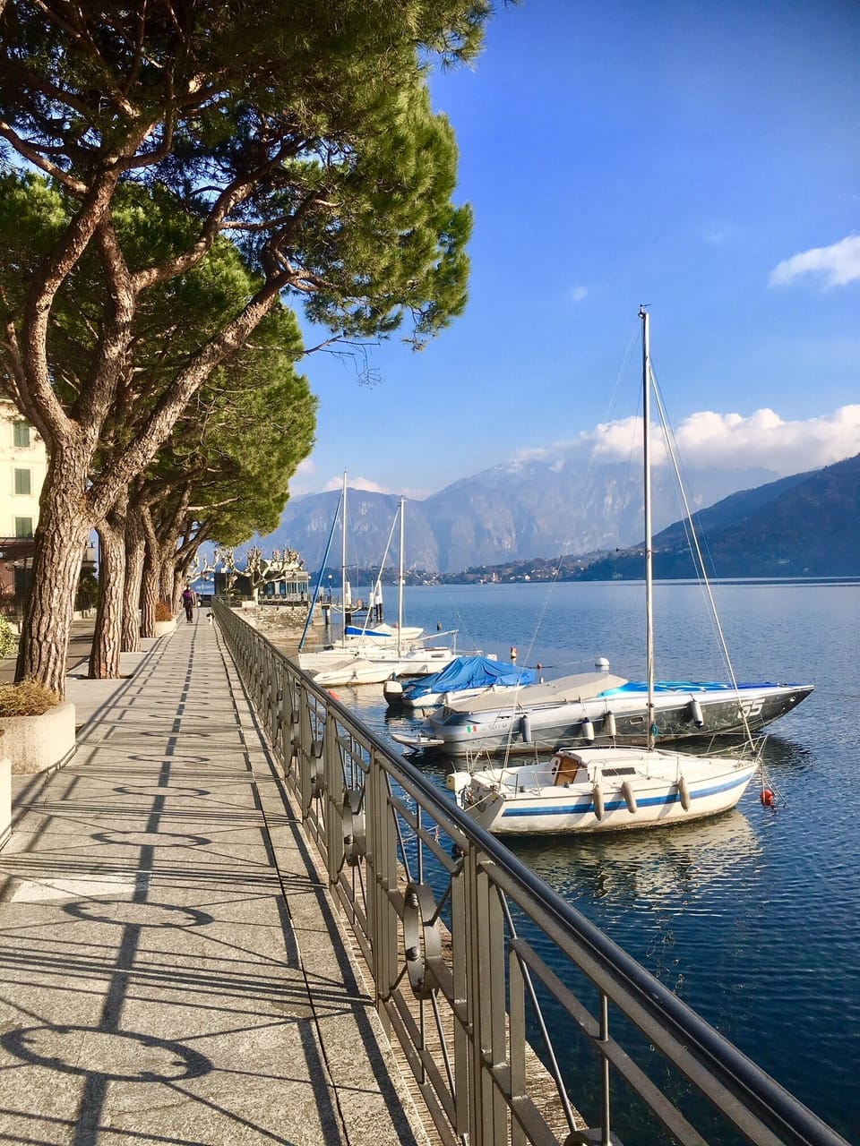 Take a stroll along the pretty promenade here in the village of Lenno.