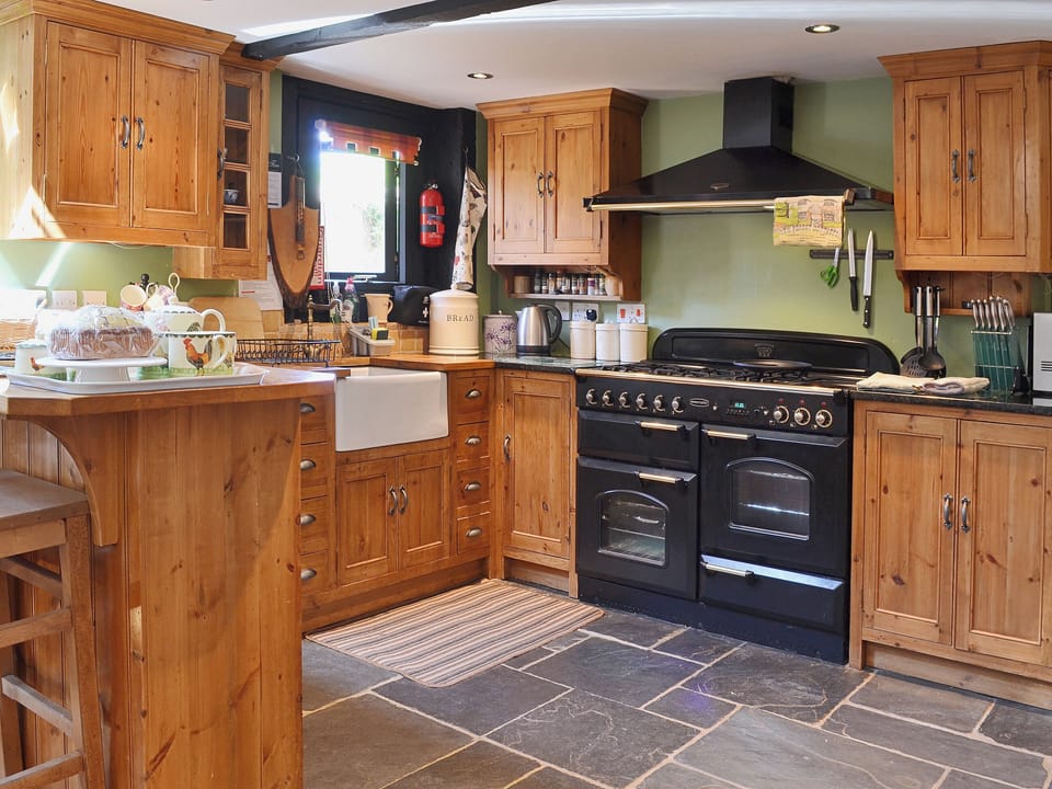 Tile floored and with a range cooker the kitchen is a comfortable place in which to work | Brook Barn - Brook and Meadow Barns, Shobley, Ringwood