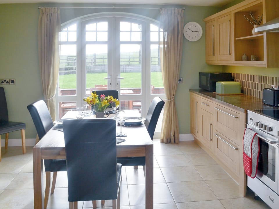 Kitchen/ dininer with patio doors leading to the garden | Seatoller, Kettleness near Whitby