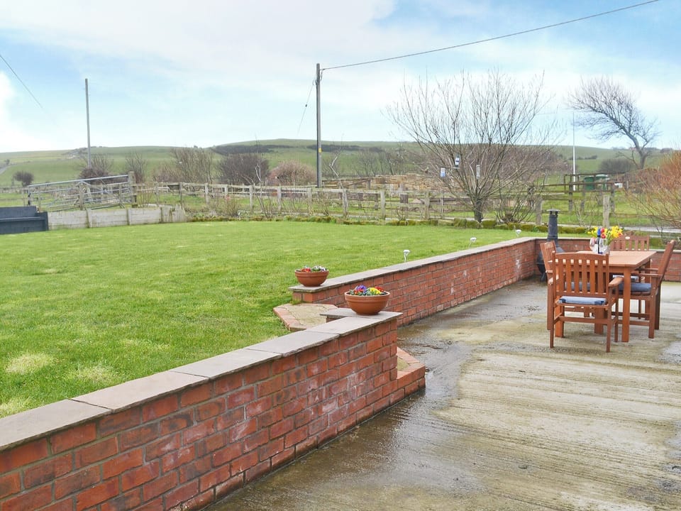 Patio and lawned garden | Seatoller, Kettleness near Whitby