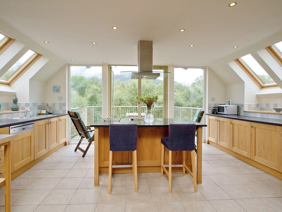 Spacious and well-equipped kitchen area with French doors onto the balcony | Carness West, North Ballachulish, Glencoe