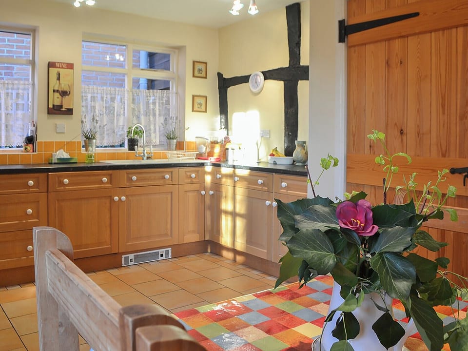 Kitchen with exposed woodwork and breakfast area | Tudor Cottage - Tudor Cottages, Romsey