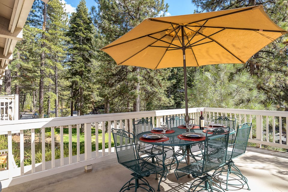 Beautiful deck off great room with gas grill and dining table