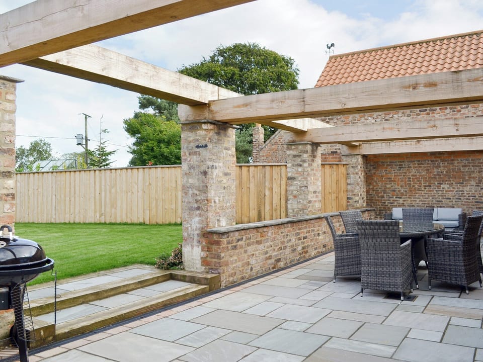 Spacious patio area | Bluebell Barn, Dunnington, near York