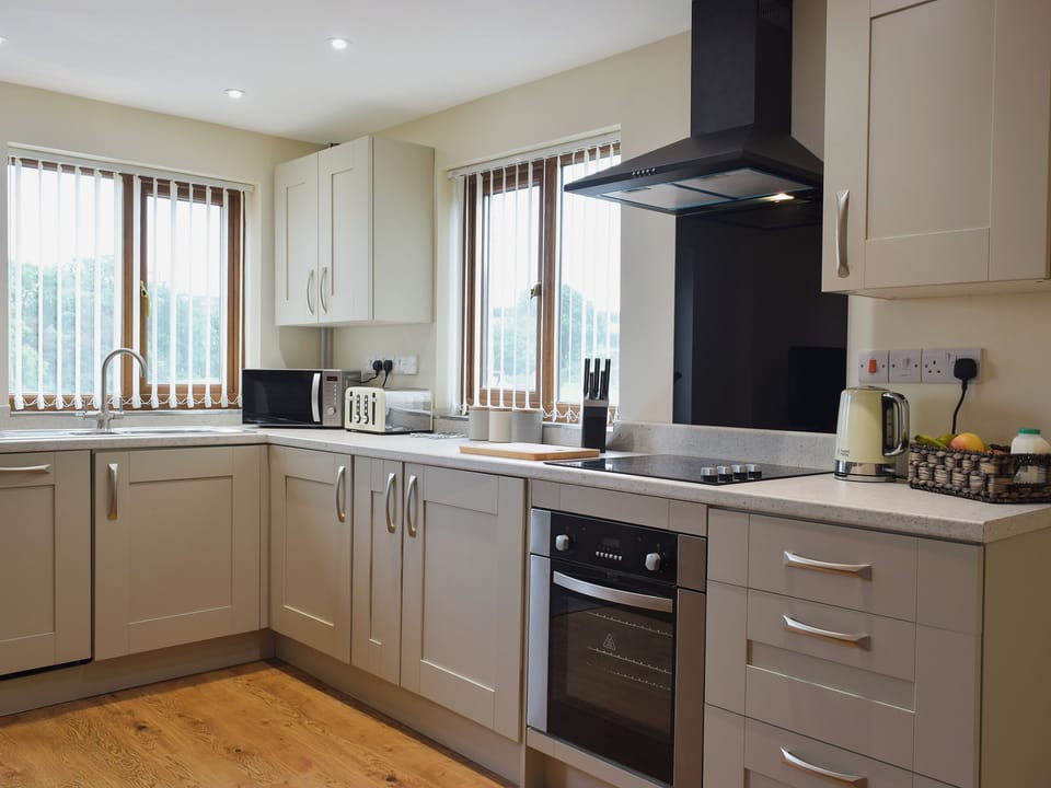 Galley style kitchen area | Gardeners Lodge, near Pembroke