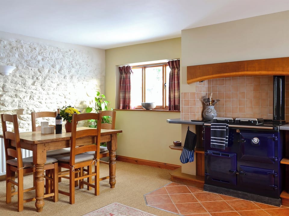 Modern fitted farmhouse-style kitchen area with Rayburn | Grange Farm Cottage, Spaunton, near Lastingham
