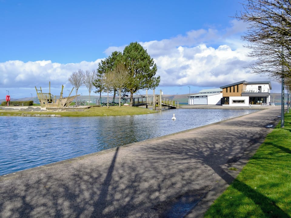 Agnew Park with a pond, caf&eacute; and the sea beyond | Park View Cottage, Stranraer