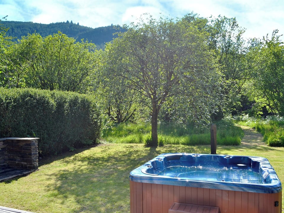 Relaxing hot tub in garden | The Ranch, Glen Massan, near Dunoon