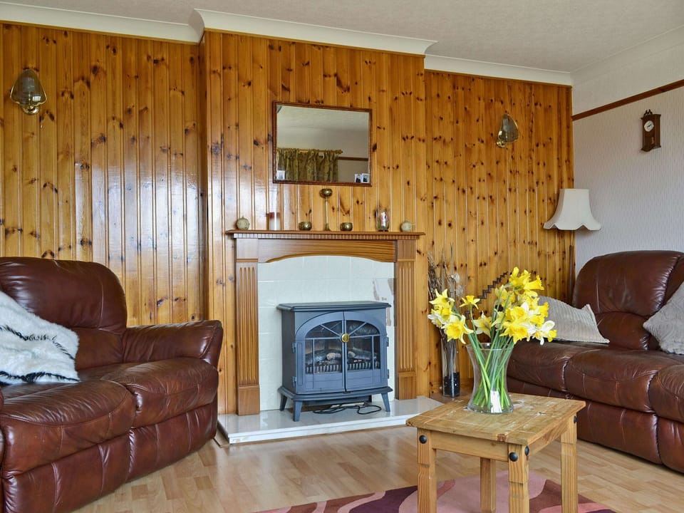 Warm and welcoming living room | Bute Cottage, Daliburgh, South Uist