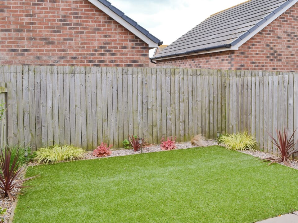 Enclosed garden with garden furniture | Sea Breeze, Beadnell, near Seahouses