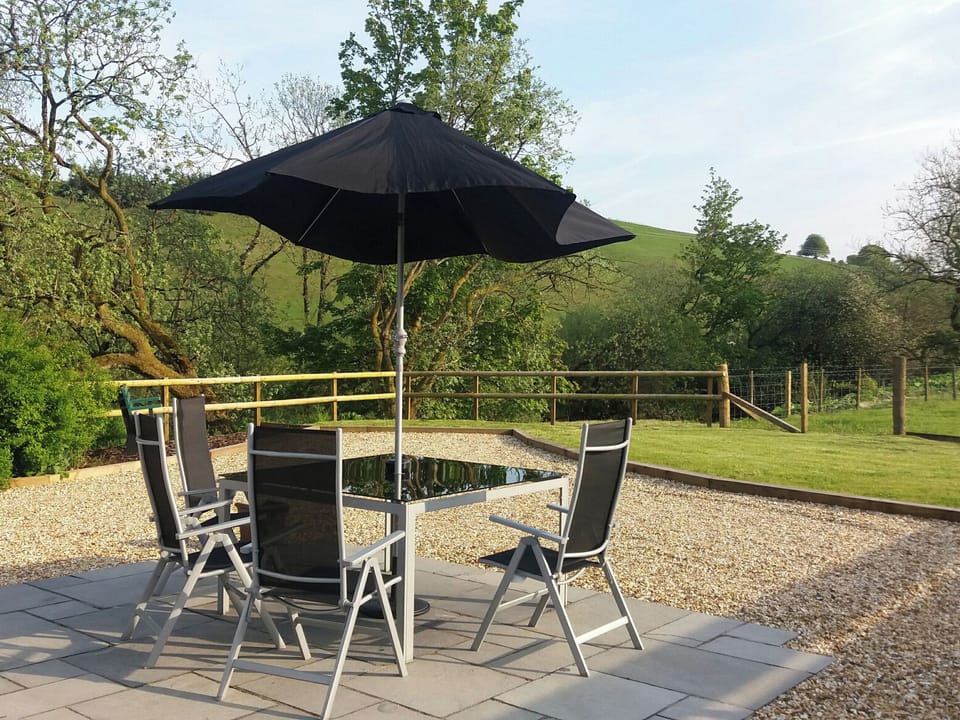 Patio area with glorious views of the surrounding area | Riverside Cottage, Boreland, near Lockerbie