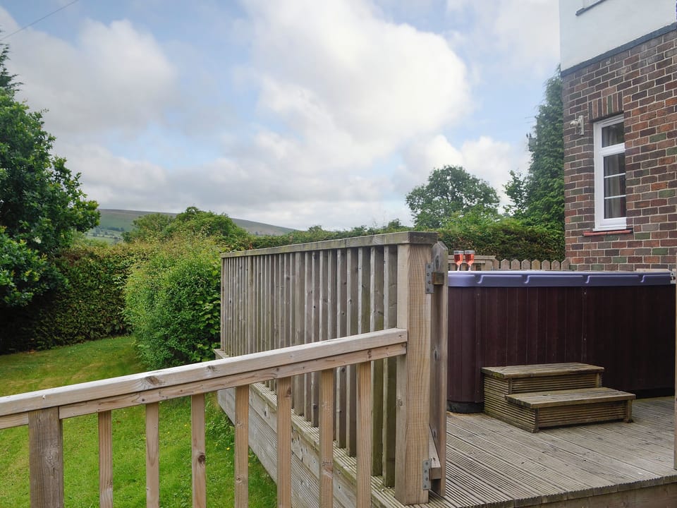 Elevated decked area with hot tub | Bevan House, Hundred House, near Builth Wells