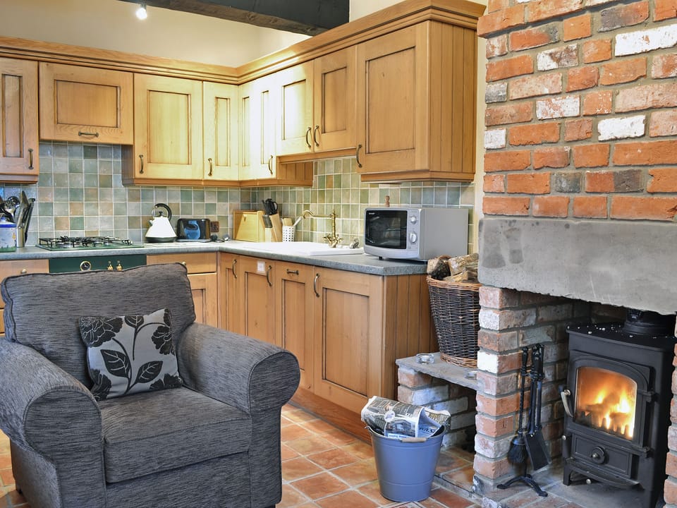 Farmhouse-style kitchen area | The Stable - Bridge Farm Holiday Cottages, Brigham