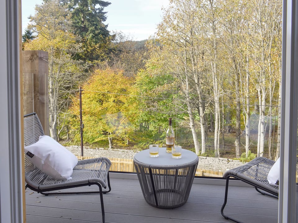 Double doors from living area lead onto the balcony | Kenmore Lodge, Balnaskeag, near Kenmore