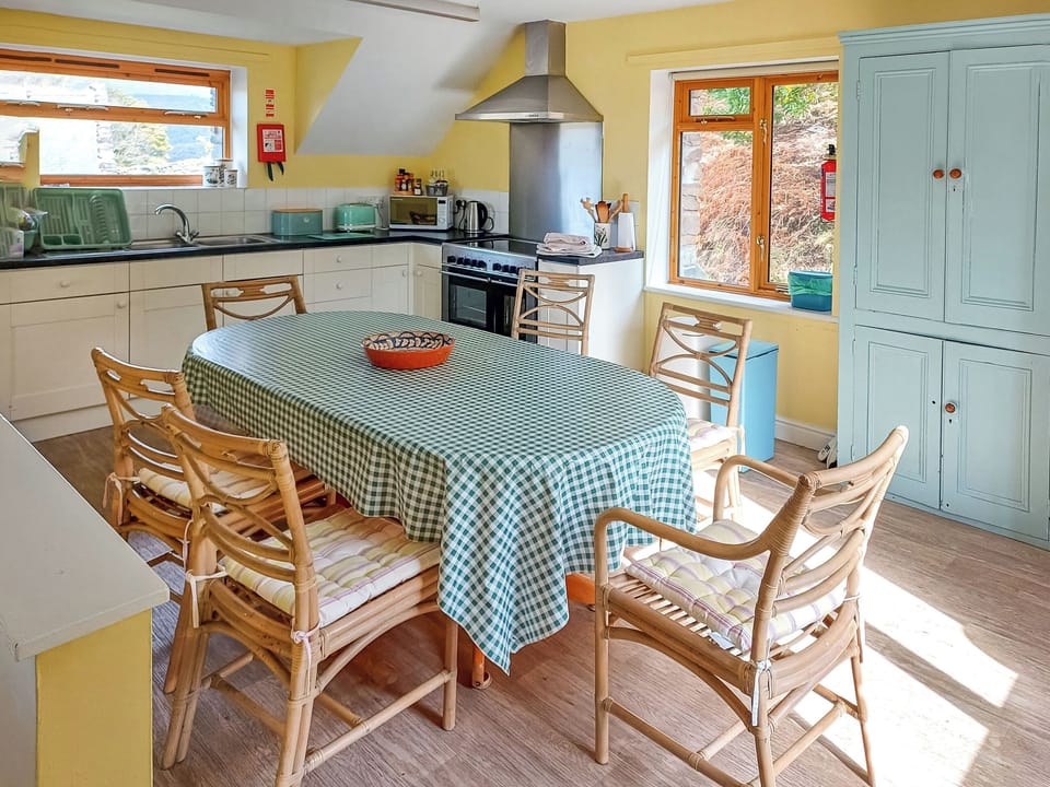 Kitchen dinner | Erw Goed Old Barn, Arthog, near Dolgellau