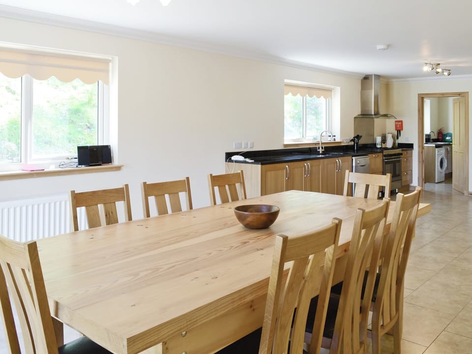 Large open plan kitchen and dining room has French windows that open out to the grounds | March Cottage, Glen Cassley, near Lairg
