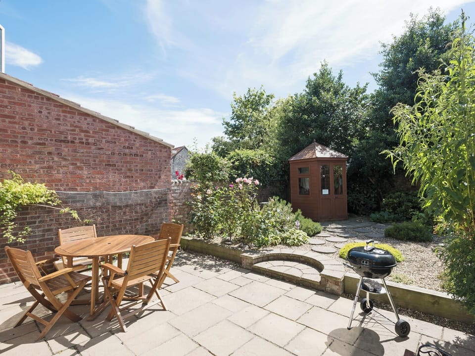 Peaceful, enclosed courtyard garden with patio | Camelot, Weybourne, near Holt
