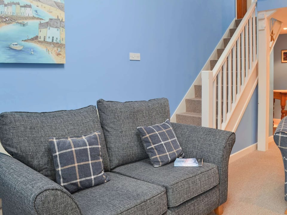 Charming living room with staircase to first floor | Wheelwright Cottage, Halwill